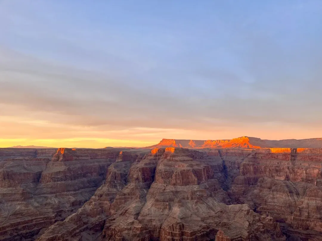 Grand Canyon West at sunset with vibrant colors and dramatic sky