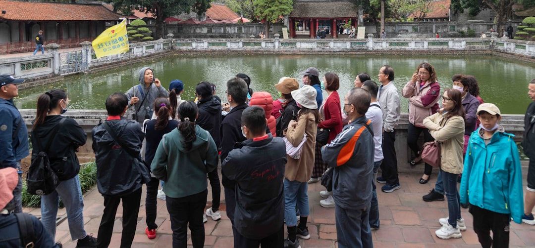 Tour guide and group at a historical site